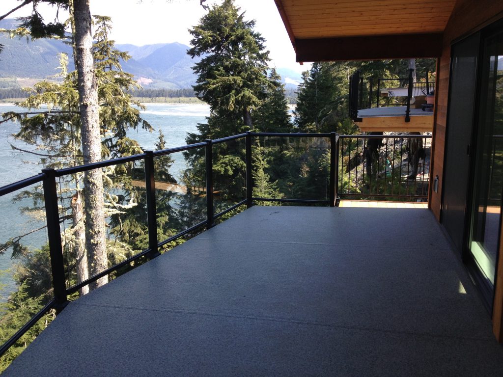 Fascia mount glass deck railings that exceeds local building codes