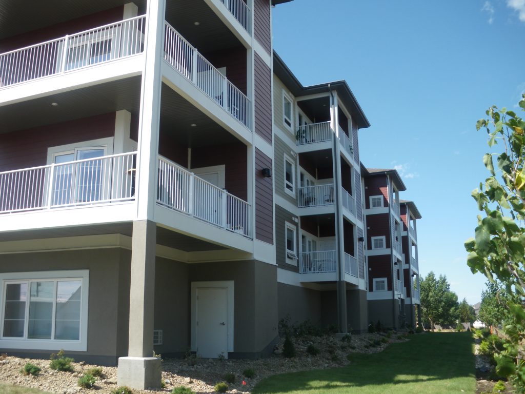 Apartment complex in Saskatchewan with white glass railings