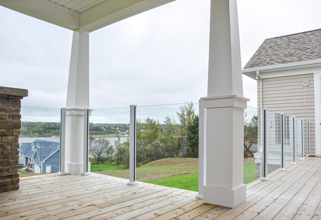 Scenic Railing on deck of large white home