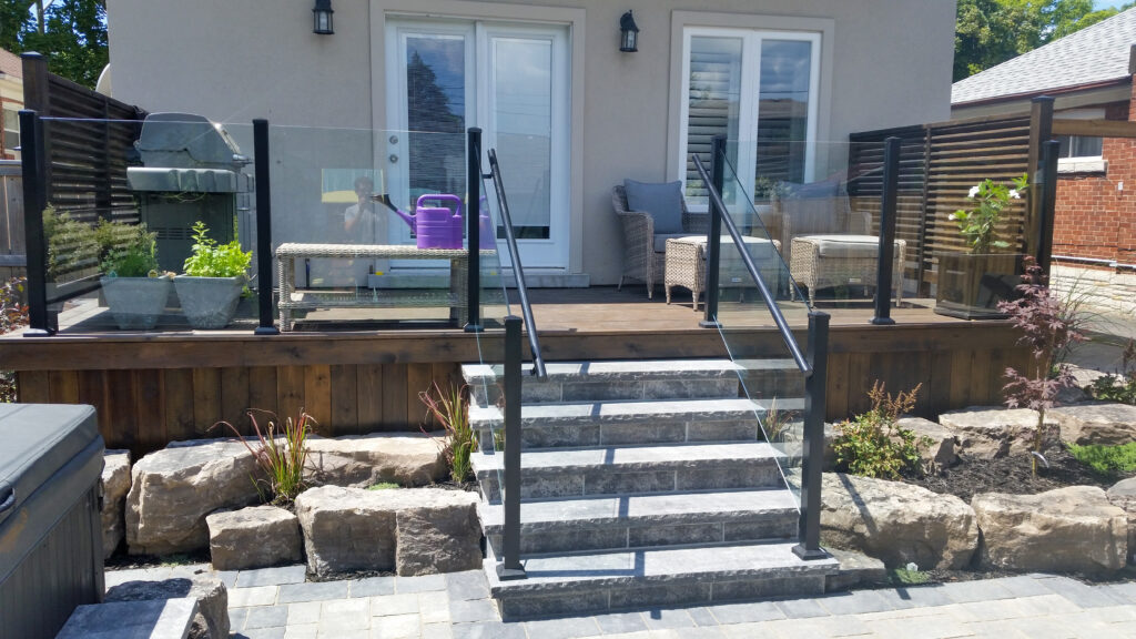 Glass railing for stairs with black aluminum railing posts
